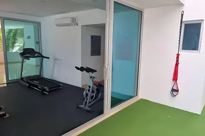 a gym with two exercise bikes and a mirror at 2 Dormitorios Morros. Vista Mar y salida playa in Cartagena de Indias