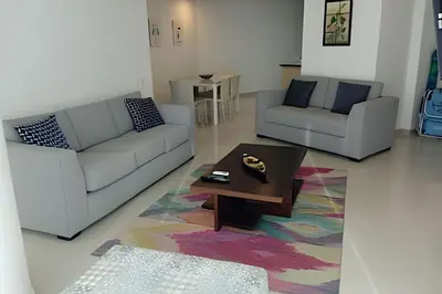 a living room with two couches and a coffee table at 2 Dormitorios Morros. Vista Mar y salida playa in Cartagena de Indias