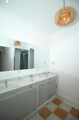 a bathroom with two sinks and a large mirror at Hostal Casa Torres Centro Historico - Adults Only in Cartagena de Indias