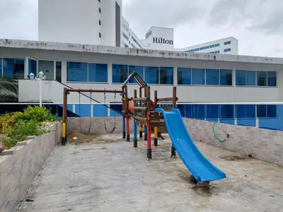 a playground in front of a building at Apartamento en cartagena in Cartagena de Indias