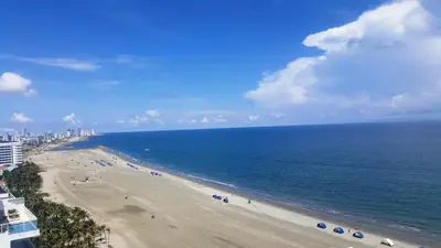 a view of a beach with umbrellas and the ocean at Morros in Cartagena de Indias