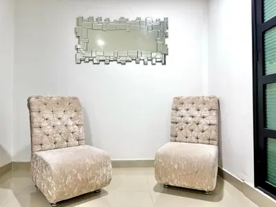 two chairs sitting next to each other in a room at HELENE HOUSE in Sincelejo