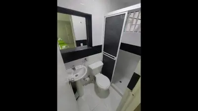 a bathroom with a sink and a toilet and a mirror at Bm-16 room near the sea with air conditioning and WIFI in Cartagena de Indias