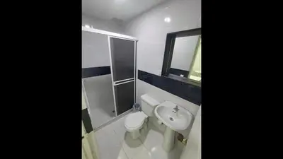 a bathroom with a toilet and a sink and a mirror at Cozy room Bm-10 near the sea with air conditioning and WIFI in Cartagena de Indias