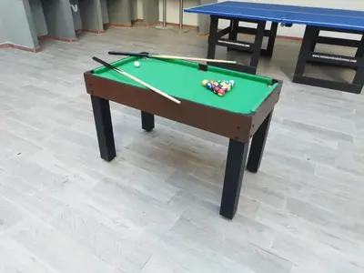 a green pool table with balls and cues on it at Bm-3 room near the sea with air conditioning and WIFI in Cartagena de Indias