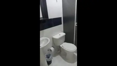 a bathroom with a toilet and a sink at Bm-5 room near the sea with air conditioning and WIFI in Cartagena de Indias
