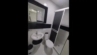 a bathroom with a sink and a toilet and a mirror at Bm-13 room near the sea with air conditioning and WIFI in Cartagena de Indias