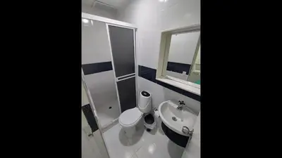 a bathroom with a toilet and a sink and a mirror at Bm-14G Charming Cartagena Lodge with Shared Pool and Private Terrace in Cartagena de Indias